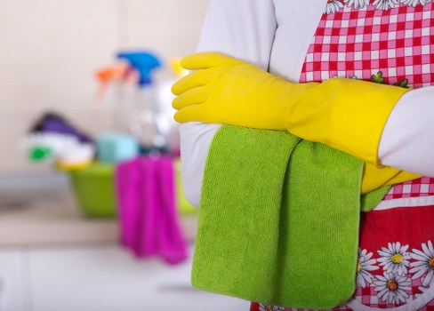 Professional cleaners working in a Richmond office with desks and shared spaces